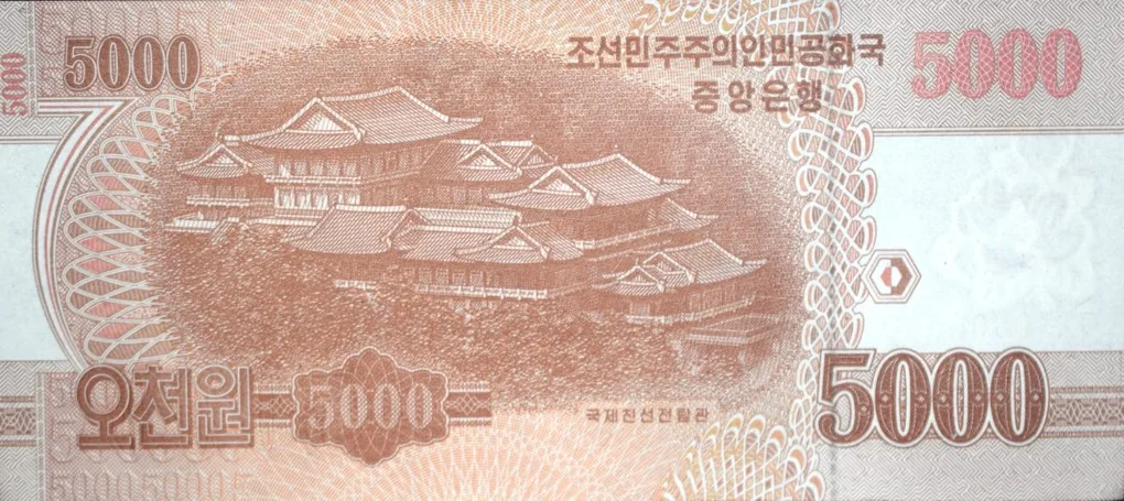 5000 Won of North Korea (AD 2013) Specimen Note with International Friendship Exhibition museum complex at Myohyang-san