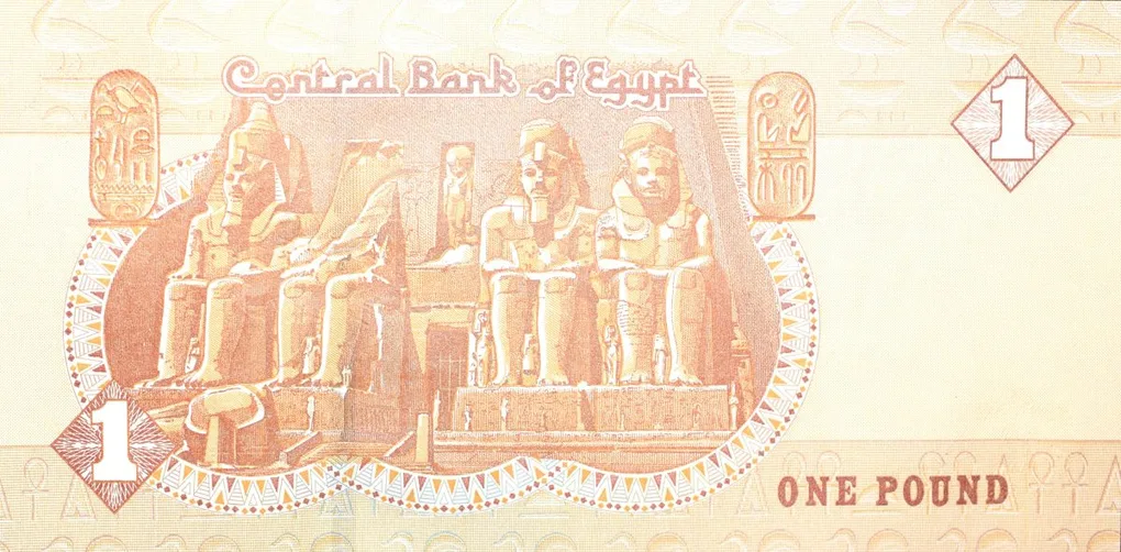 1 Pound of Egypt (AD 2016) with Colossal statues of Ramses II seated at the main entrance to the Great Temple at Abu Simbel, near Asw?n, Egypt