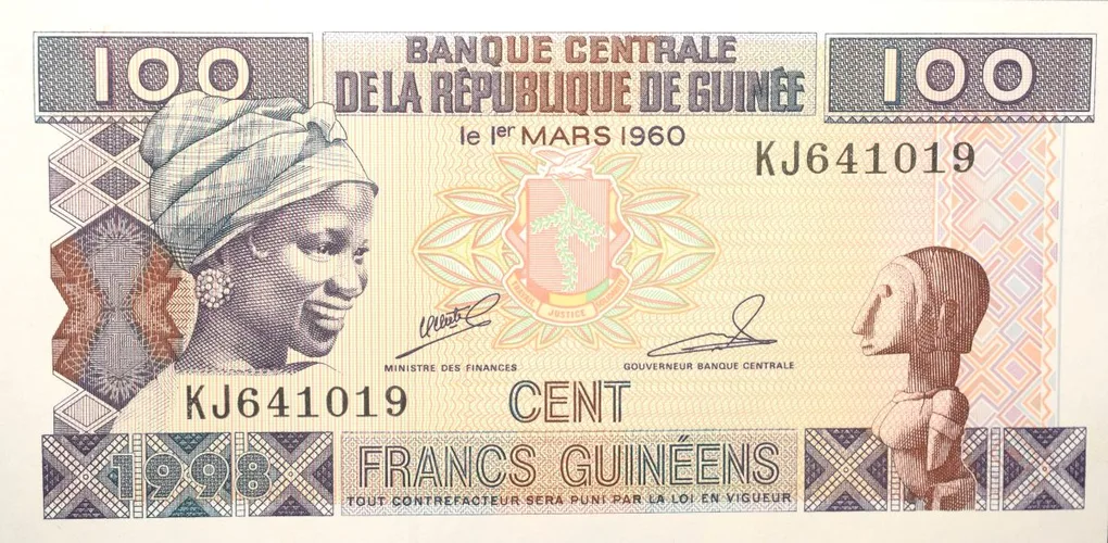 100 Francs of Guinea Country (AD 1998) with Peasant work scene in a plantation of bananas, with people harvesting fruits