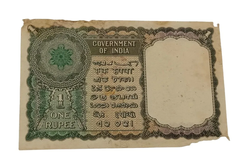 One Rupee Old Floral Motif Design First Issue K.R K Menon with Semi-Fancy "916" & Ending "777" Serial Numbers**EX-RARE** High Collectable Grade with Minor Torns.