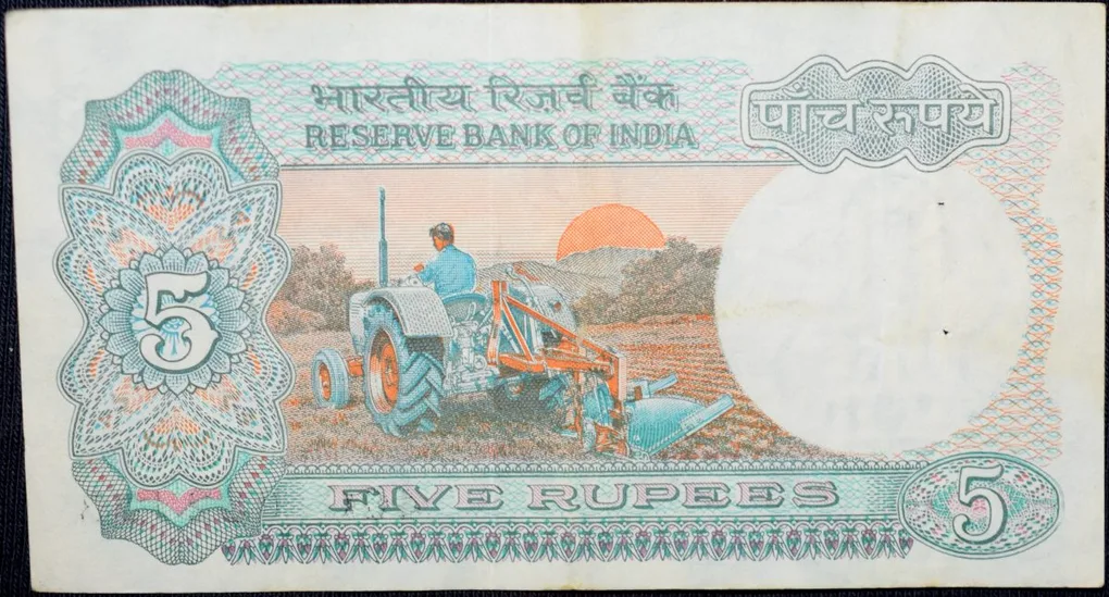 5 Rupees of Republic India (AD 1988) with Farmer ploughing with a tractor while sun is rising - S. Venkitaramanan Signature