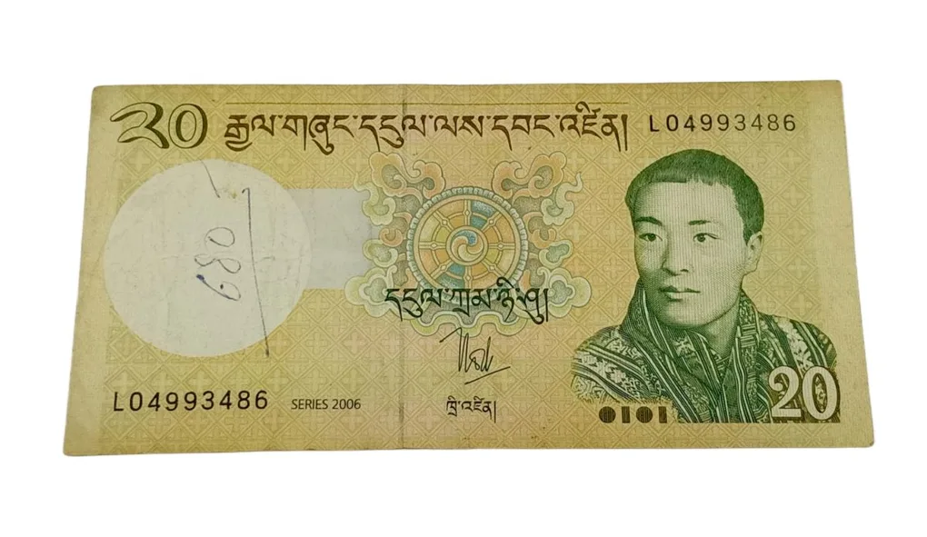 Bhutan 20 Ngultrum "Jigme Khesar Namgyel Wangchuck" Portrait Note in Collectable Grade.