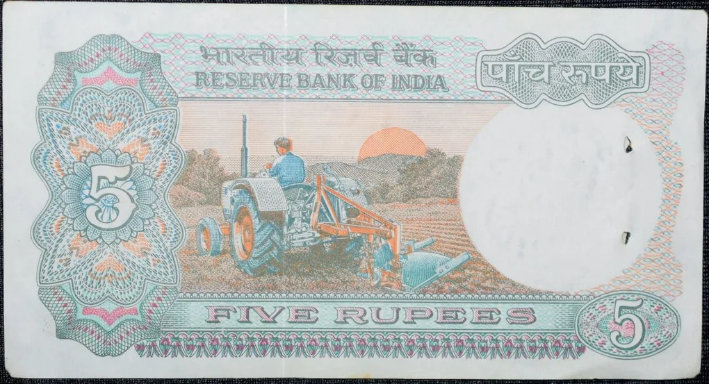 5 Rupees of Republic India (AD 1988) with Farmer ploughing with a tractor while sun is rising - S. Venkitaramanan Signature
