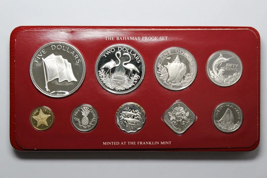 The 1975 Bahamas Proof Set features nine beautifully struck coins, including denominations from 1 cent to 5 dollars. Struck by the Franklin Mint in sterling silver (.925), the silver coins include the 50 cents, $1, $2, and $5 pieces