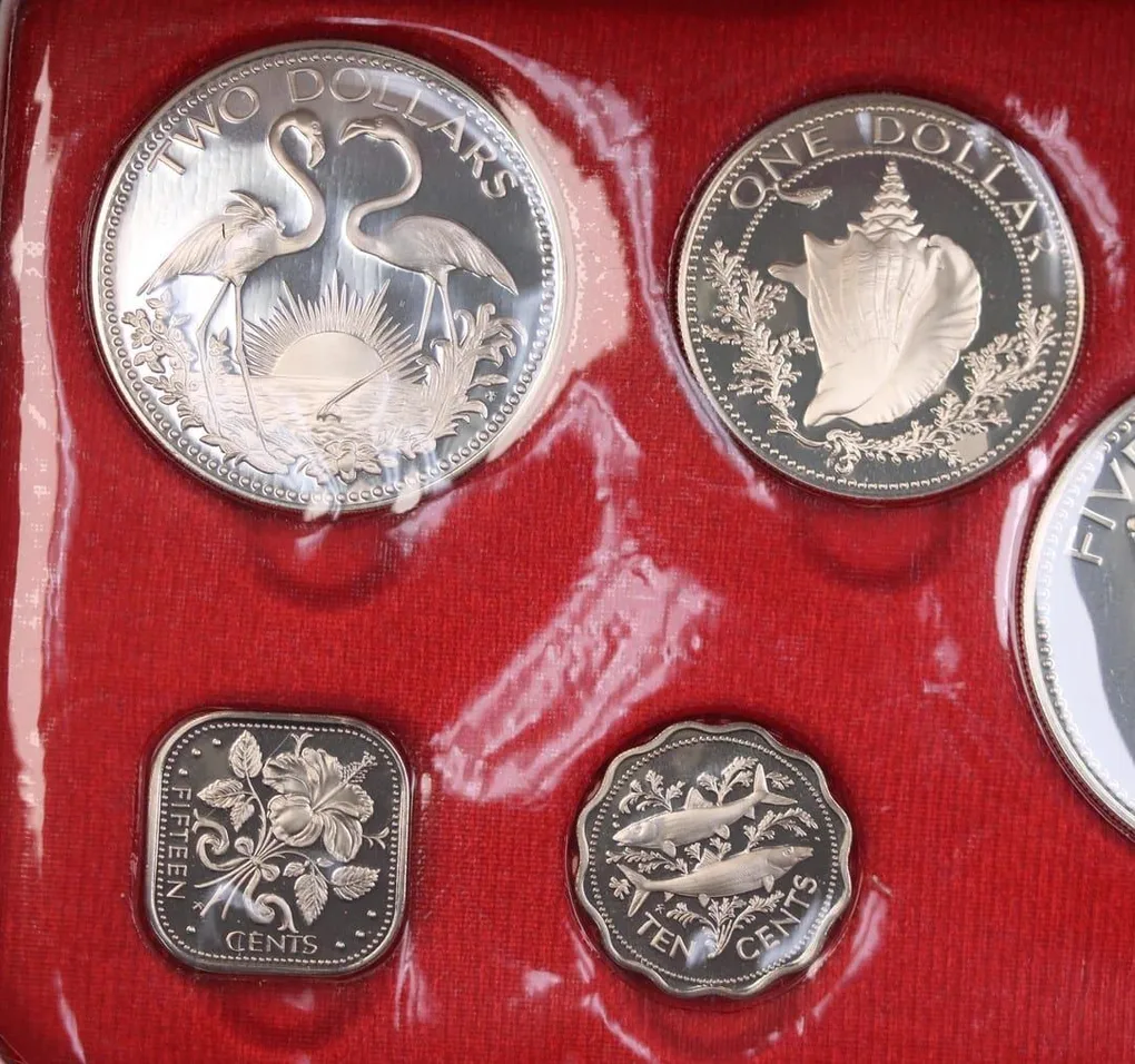 The 1975 Bahamas Proof Set features nine beautifully struck coins, including denominations from 1 cent to 5 dollars. Struck by the Franklin Mint in sterling silver (.925), the silver coins include the 50 cents, $1, $2, and $5 pieces