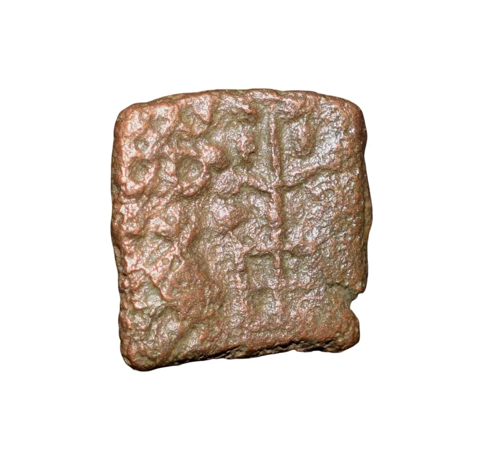 Copper Coin of Ancient Ujjaini (2nd Cen. BC) with Ujjaini Symbol above Bull walking left, Tree Railing/Ujjaini Symbol