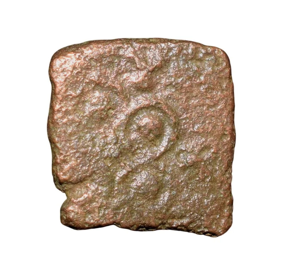 Copper Coin of Ancient Ujjaini (2nd Cen. BC) with Ujjaini Symbol above Bull walking left, Tree Railing/Ujjaini Symbol
