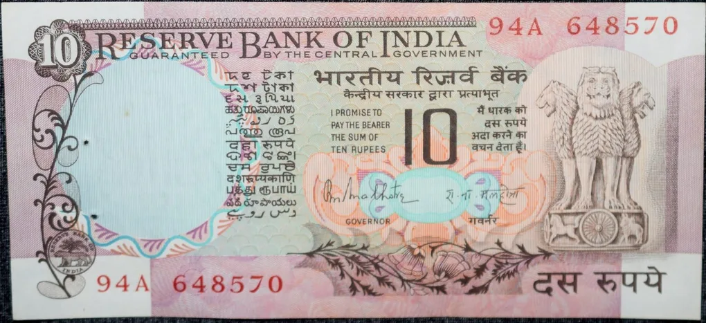 10 Rupees of Republic India (AD 1970-1990) with Two blue peacocks or Indian peafowl (Pavo cristatus) sitting on branches of an old mango tree surrounded by antelopes, horses, flowers, and a bird - R.N. Malhotra
