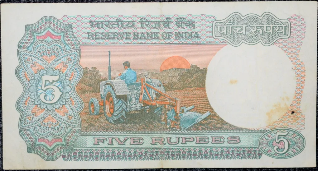 5 Rupees of Republic India (AD 1983) with Farmer ploughing with a tractor while sun is rising - Manmohan Singh Signature