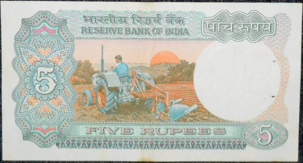5 Rupees of Republic India (AD 1983) with Farmer ploughing with a tractor while sun is rising - Manmohan Singh Signature