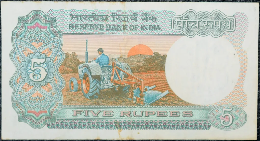 5 Rupees of Republic India (AD 1983) with Farmer ploughing with a tractor while sun is rising - Manmohan Singh Signature