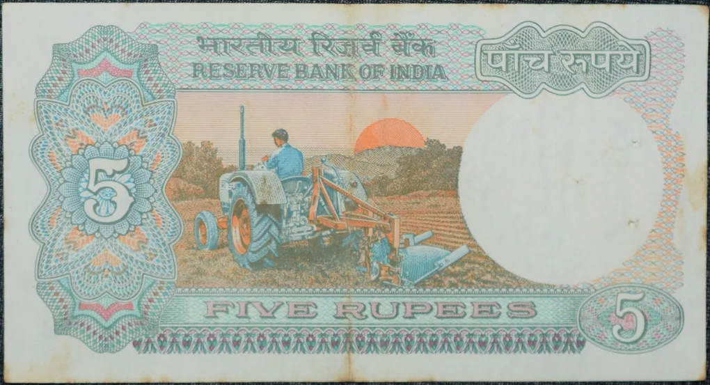 5 Rupees of Republic India (AD 1983) with Farmer ploughing with a tractor while sun is rising - Manmohan Singh Signature