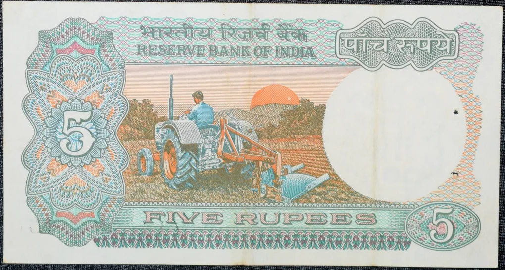 5 Rupees of Republic India (AD 1983) with Farmer ploughing with a tractor while sun is rising - Manmohan Singh Signature