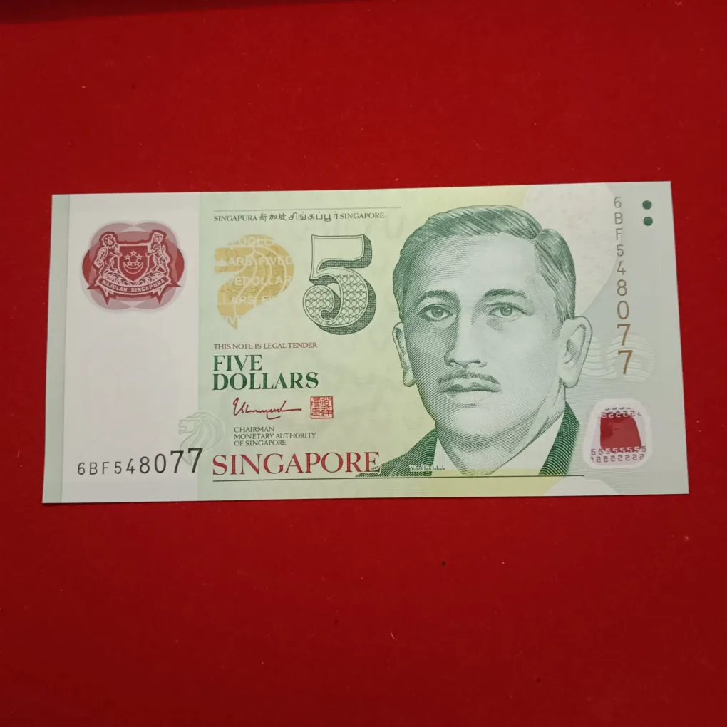 Rare Green Singapore 5 Dollars polymer banknote from the Portrait Series featuring Encik Yusof bin Ishak on the front