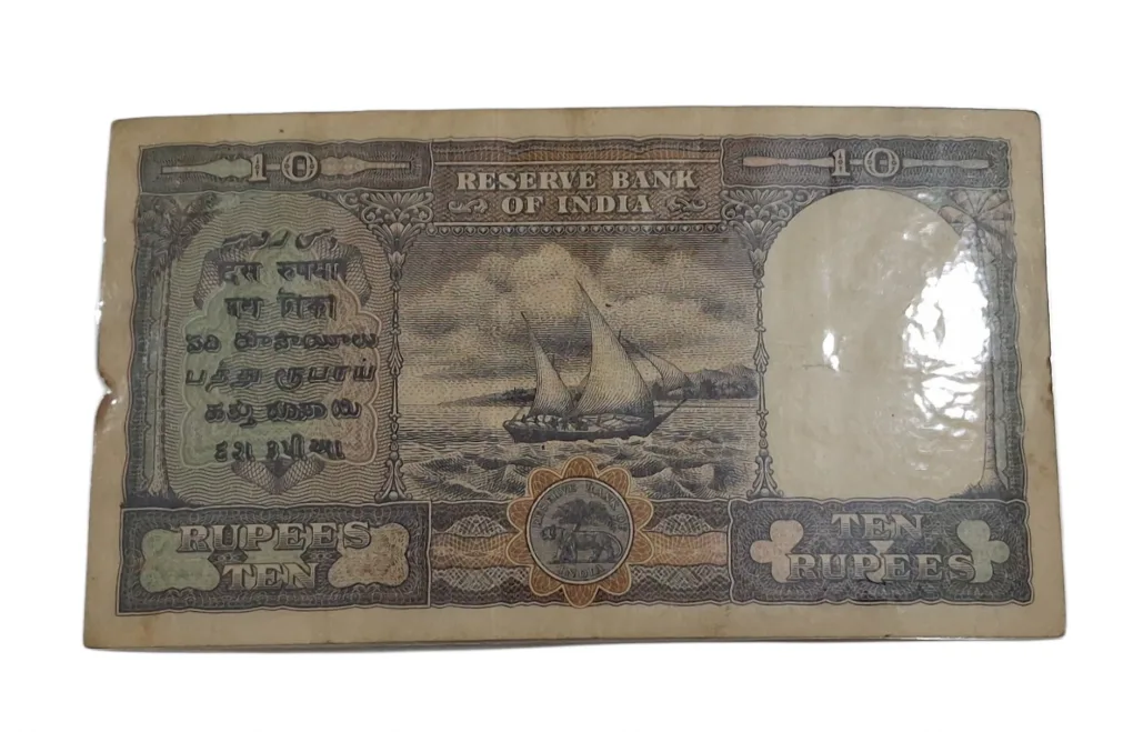 BRITISH INDIA 10 Rupees C.D DESHMUKH King GEORGE-VI in High Collectable Grade but "LAMINATED" Note.