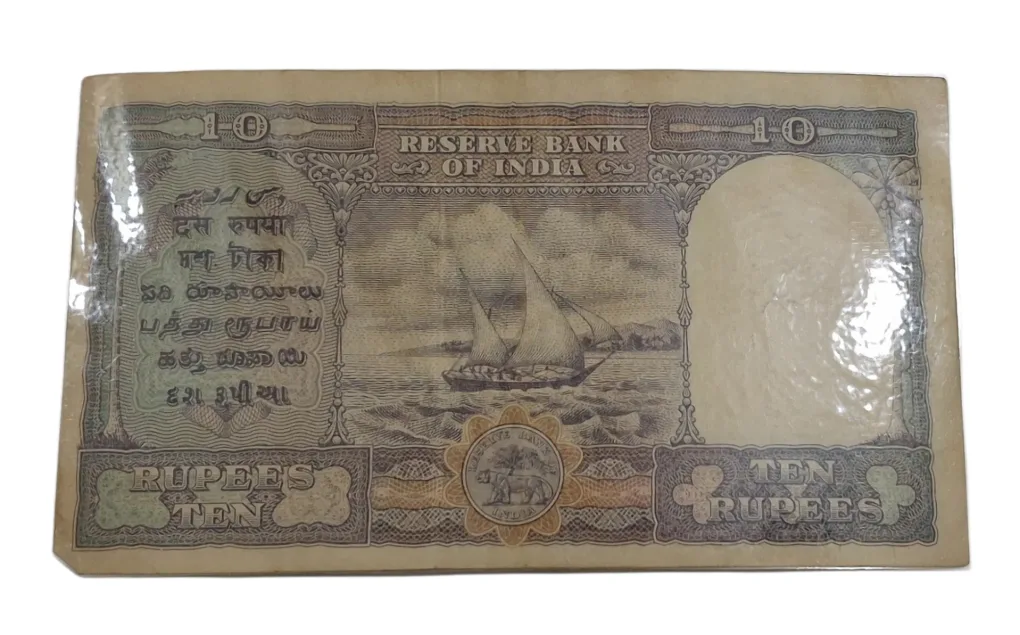 BRITISH INDIA 10 Rupees C.D DESHMUKH King GEORGE-VI in High Collectable Grade but "LAMINATED" Note.