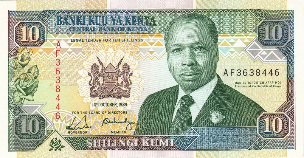 Old 10 Shillings of Kenya (AD 1989-1994) with President Daniel Toroitich Arap Moi Facing/Kabarnet High School at centre with mountain in background