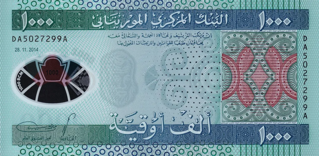 Polymer 1000 Ouguiya of Mauritania Country (AD 2014) with fish at left, Camel, hut and Tichit Mosque